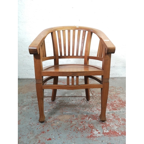 209 - An Indonesian solid teak Betawi chair - approx. 89cm high x 60cm wide x 47cm deep