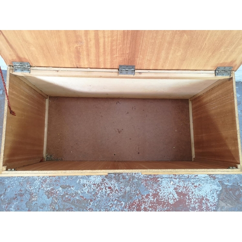 22c - A mid 20th century walnut and plywood blanket box with atomic supports - approx. 70cm high x 112 wid... 