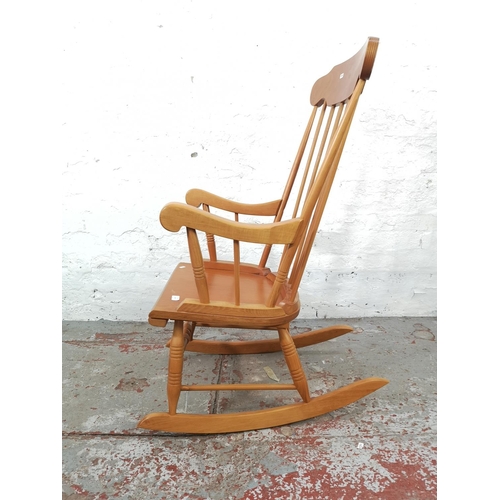 26 - A beech spindle back farmhouse rocking chair - approx. 105cm high x 55cm wide x 75cm deep