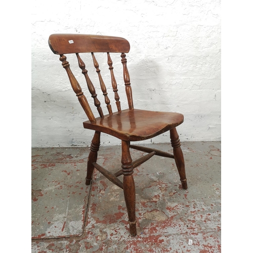 29 - Two Victorian elm and beech farmhouse dining chairs