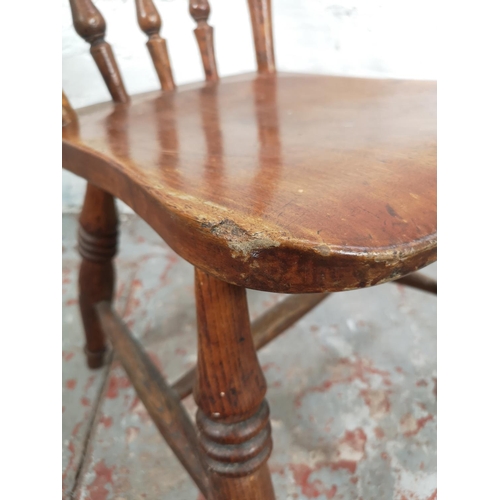 29 - Two Victorian elm and beech farmhouse dining chairs