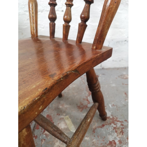 29 - Two Victorian elm and beech farmhouse dining chairs