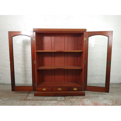 3 - An Edwardian mahogany two door bookcase with three internal shelves and three lower drawers - approx... 