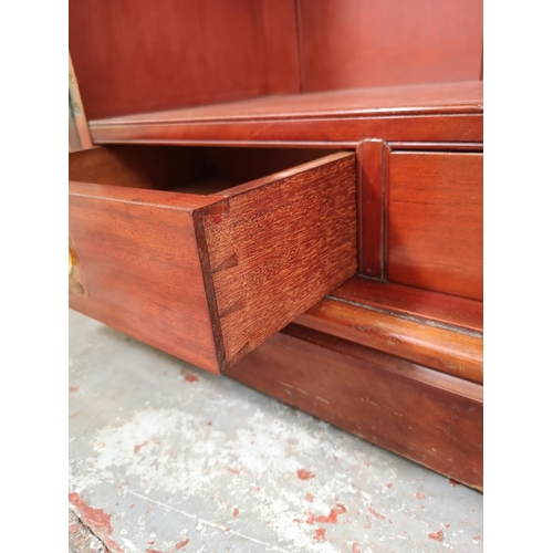 3 - An Edwardian mahogany two door bookcase with three internal shelves and three lower drawers - approx... 