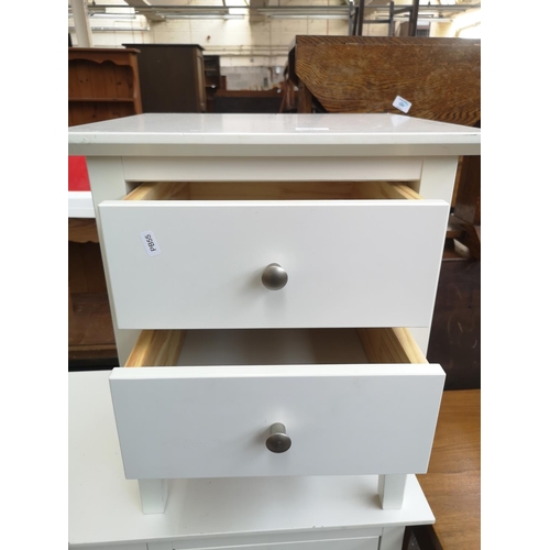 32 - A modern white laminate six drawer dressing table with matching two drawer bedside cabinet and dress... 