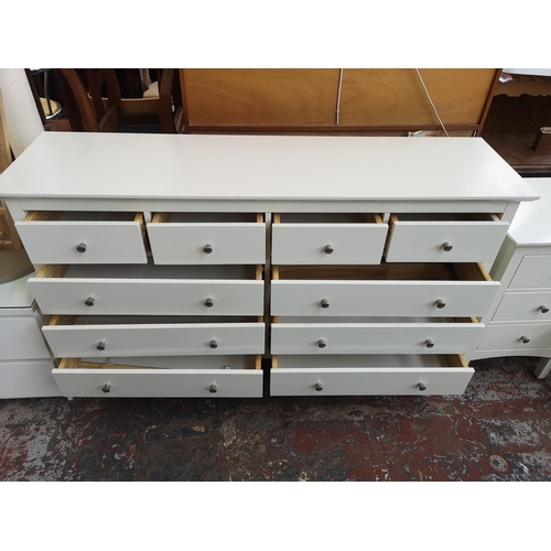 33 - A modern white laminate chest of four short over six long drawers - approx. 94cm high x 157cm wide x... 