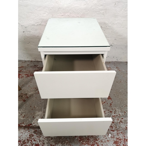 35 - Two pieces of modern furniture, one white laminate two drawer bedside cabinet and one circular side ... 