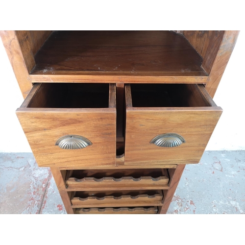 39 - An Indonesian teak tall wine cabinet with two upper drawers - approx. 169cm high x 65cm wide x 48cm ... 