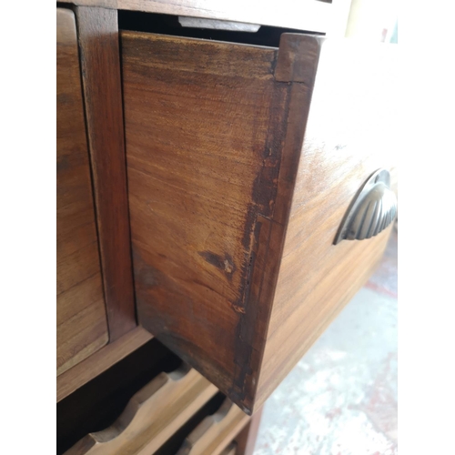 39 - An Indonesian teak tall wine cabinet with two upper drawers - approx. 169cm high x 65cm wide x 48cm ... 