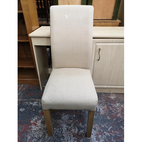 51 - A modern beech effect office desk with beige upholstered dining chair - approx. 76.5cm high x 124cm ... 