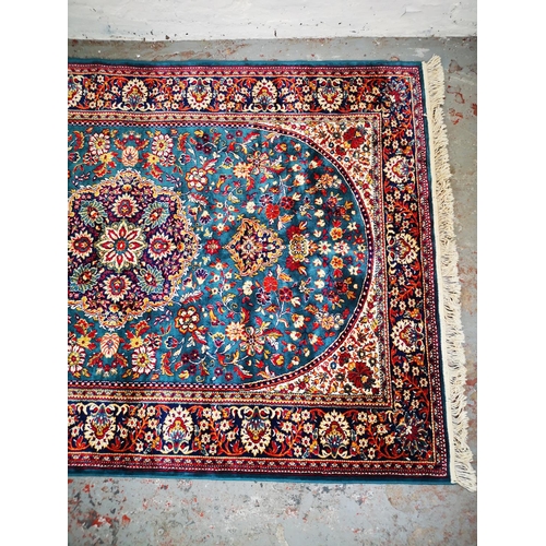 52 - An Egyptian silk rug - approx. 226cm x 146cm