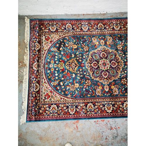 52 - An Egyptian silk rug - approx. 226cm x 146cm