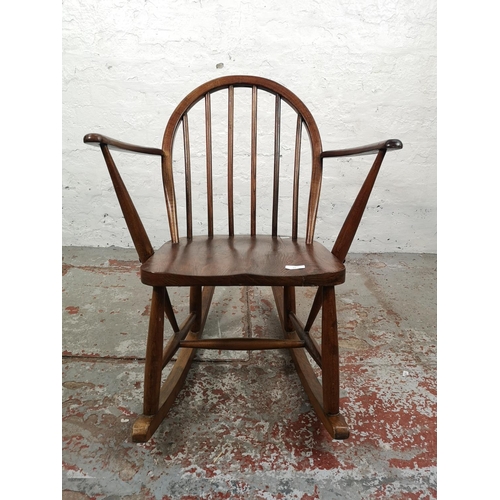 55 - A mid 20th century elm and beech child’s rocking chair - approx. 75cm high x 60cm wide x 75cm deep