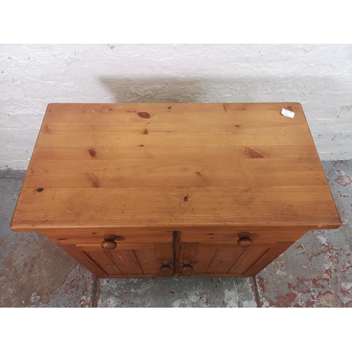 65 - A modern pine cabinet with two drawers and two lower doors - approx. 76cm high x 75cm wide x 39cm de... 