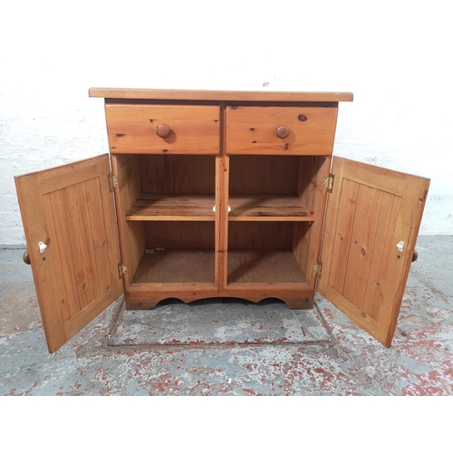 65 - A modern pine cabinet with two drawers and two lower doors - approx. 76cm high x 75cm wide x 39cm de... 