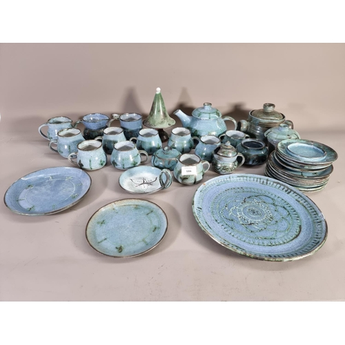 1206 - A large collection of blue glazed studio pottery signed 'B' to base comprising teapot, coffee cups, ... 