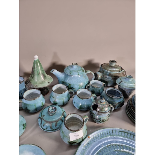 1206 - A large collection of blue glazed studio pottery signed 'B' to base comprising teapot, coffee cups, ... 