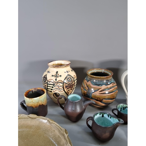 1210 - A large collection of studio pottery to include fish design vase signed 'DSR 54' to base, blue drip ... 