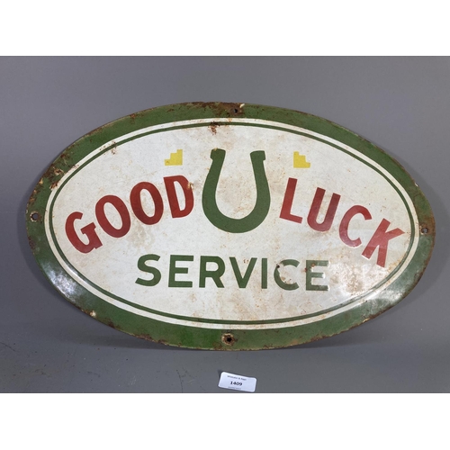 1409 - A Good Luck Service enamel sign - approx. 50cm wide x 30cm high