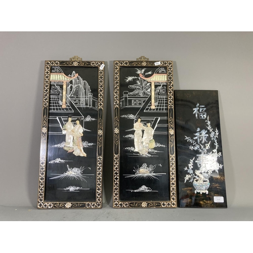 1418 - Three Oriental black lacquer and mother of pearl panels, two - approx. 60cm x 25cm and one - approx.... 