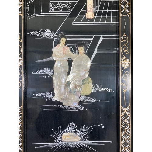 1418 - Three Oriental black lacquer and mother of pearl panels, two - approx. 60cm x 25cm and one - approx.... 