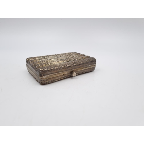 1012 - A white metal cigarette box with acanthus leaf design - approx. 8cm x 5.5cm and gross weight 96 gram... 