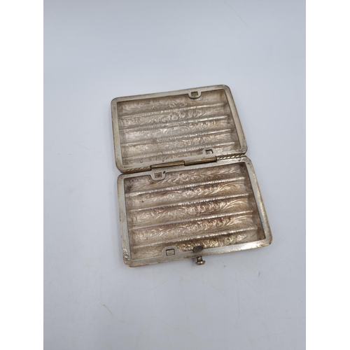 1012 - A white metal cigarette box with acanthus leaf design - approx. 8cm x 5.5cm and gross weight 96 gram... 