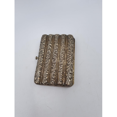 1012 - A white metal cigarette box with acanthus leaf design - approx. 8cm x 5.5cm and gross weight 96 gram... 