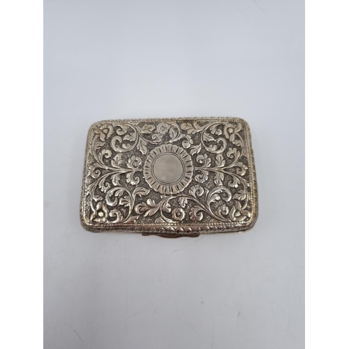 1013 - A white metal cigarette box with acanthus leaf design - approx. 9cm x 6cm and gross weight 116 grams