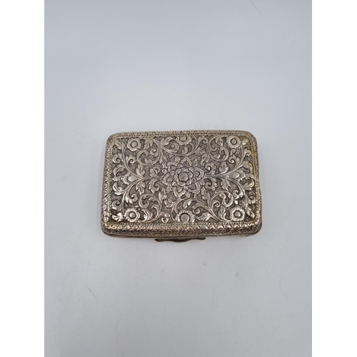 1013 - A white metal cigarette box with acanthus leaf design - approx. 9cm x 6cm and gross weight 116 grams