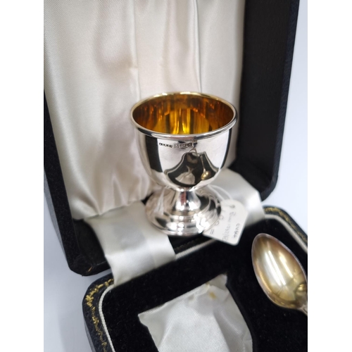 1037 - A boxed hallmarked Birmingham silver three piece Christening set comprising filled egg cup, napkin r... 