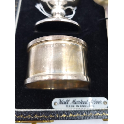 1037 - A boxed hallmarked Birmingham silver three piece Christening set comprising filled egg cup, napkin r... 