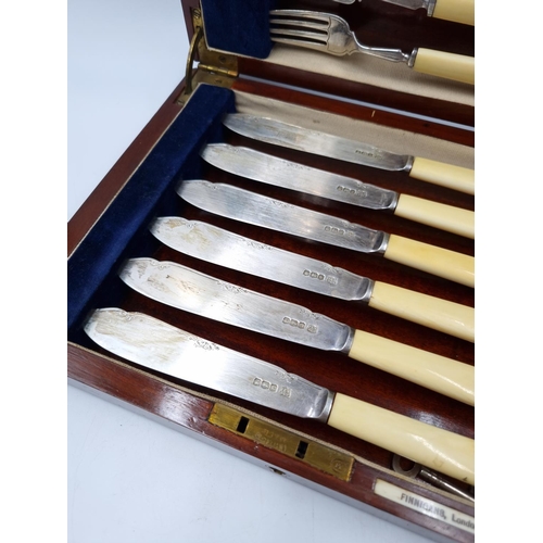 1039 - A Finnigans mahogany cutlery case containing twelve hallmarked Sheffield silver fish knives and fork... 