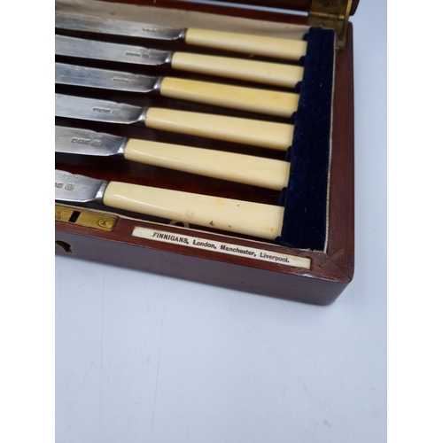 1039 - A Finnigans mahogany cutlery case containing twelve hallmarked Sheffield silver fish knives and fork... 