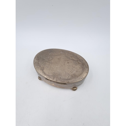 1048 - An Edwardian hallmarked Birmingham silver oval lidded trinket box by William Neale, dated 1909 - app... 