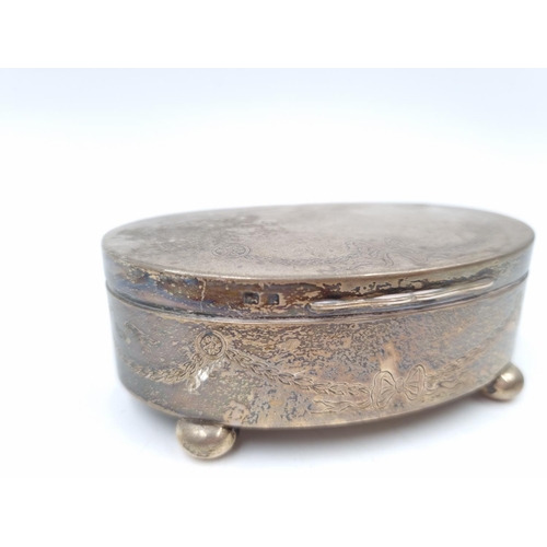 1048 - An Edwardian hallmarked Birmingham silver oval lidded trinket box by William Neale, dated 1909 - app... 