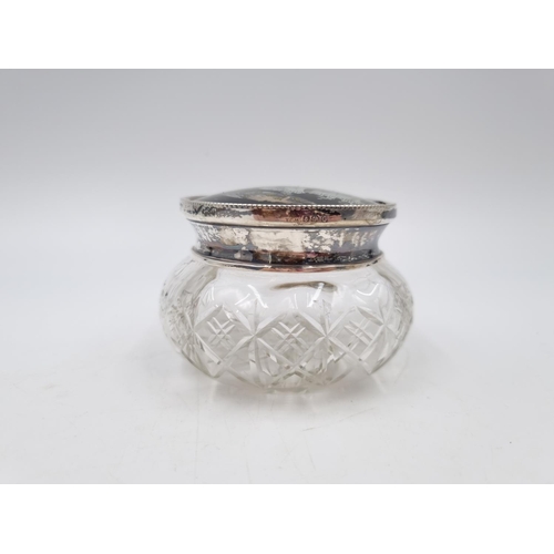 1051 - An Art Deco cut glass jar with hallmarked Birmingham silver and butterfly wing lid, dated 1927 - app... 