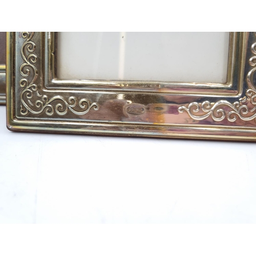 1058 - A pair of Francis Howard Ltd hallmarked Sheffield silver photo frames - approx. 18cm high x 14cm wid... 