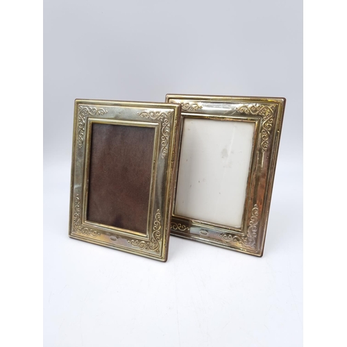 1061 - A pair of Francis Howard Ltd hallmarked Sheffield silver photo frames - approx. 18cm high x 14cm wid... 