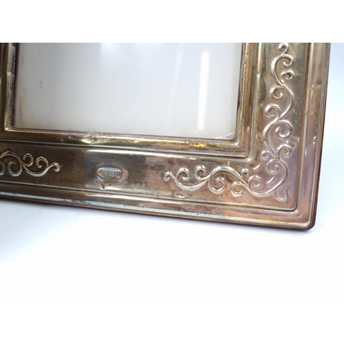 1061 - A pair of Francis Howard Ltd hallmarked Sheffield silver photo frames - approx. 18cm high x 14cm wid... 