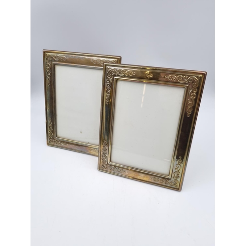 1062 - A pair of Francis Howard Ltd hallmarked Sheffield silver photo frames - approx. 22.5cm high x 17.5cm... 