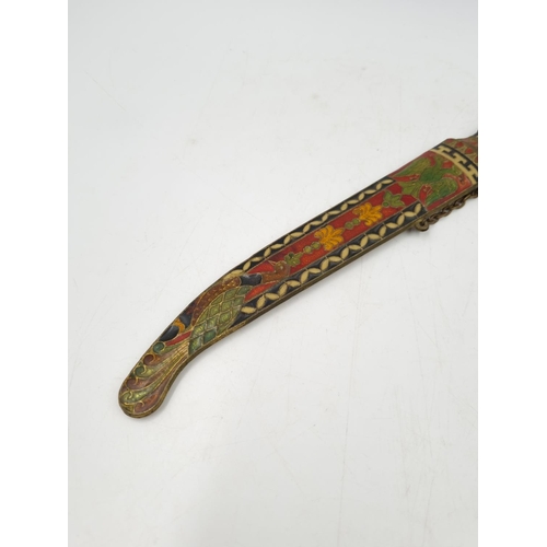 1068 - A cloisonné paper knife and scabbard depicting double headed eagle and stylised peacock, possibly Ru... 