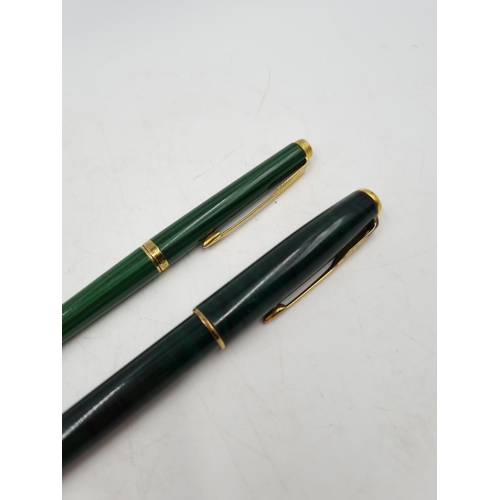 1077 - Two vintage Parker malachite lacquer cased pens, one ball point and one fountain