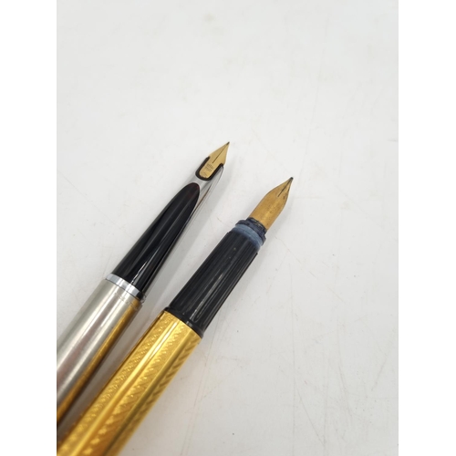 1081 - Four Waterman writing instruments, one propelling pencil, two fountain pens with 18ct gold nibs and ... 