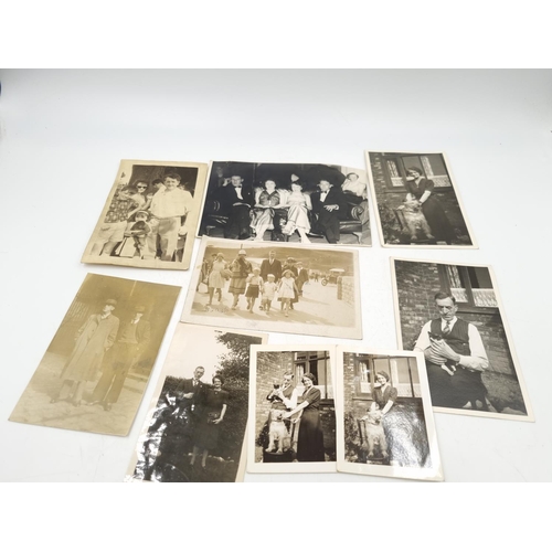 1108 - A large collection of antique and vintage photographs to include portrait, military etc.