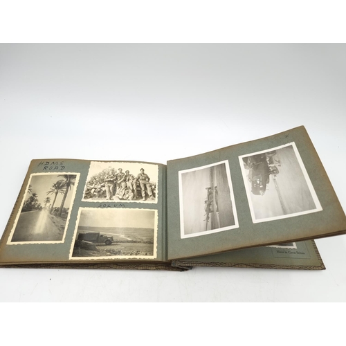 1108 - A large collection of antique and vintage photographs to include portrait, military etc.