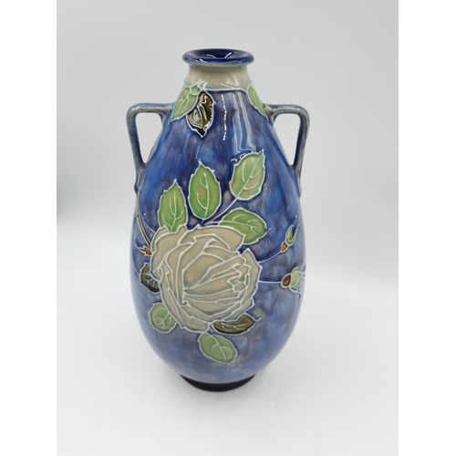 1131 - A late 19th/early 20th century Royal Doulton vase with tube lined rose design - approx. 29cm high