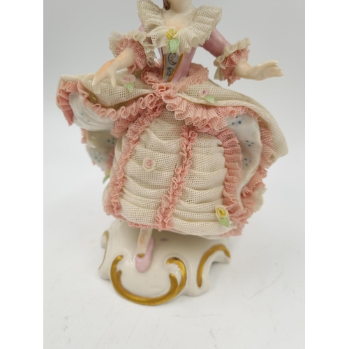 1141 - A German porcelain lace figurine - approx. 15.5cm high