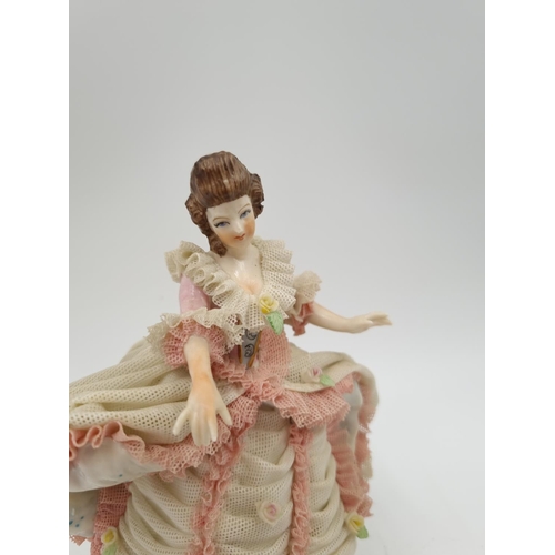 1141 - A German porcelain lace figurine - approx. 15.5cm high