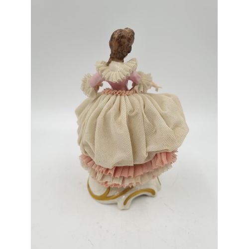 1141 - A German porcelain lace figurine - approx. 15.5cm high